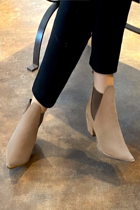 Tan beige and taupe brown women's ankle boots, with elastics. Pointed toe. Medium cone heels. Worn view - Florence KOOIJMAN